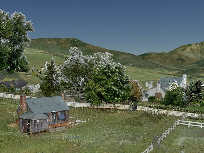 Point cloud data set of a cabin on farmland surrounded by hills and trees. 