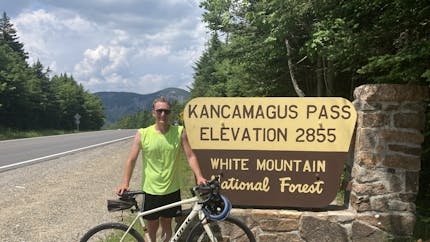 Luke McKinstry with a mountain bike at Kancamagus Pass