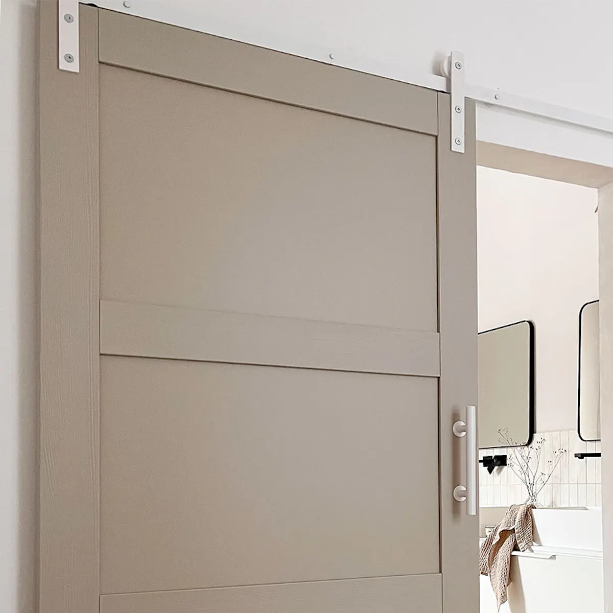 Pebble gray door with white sliding system at bathroom entrance