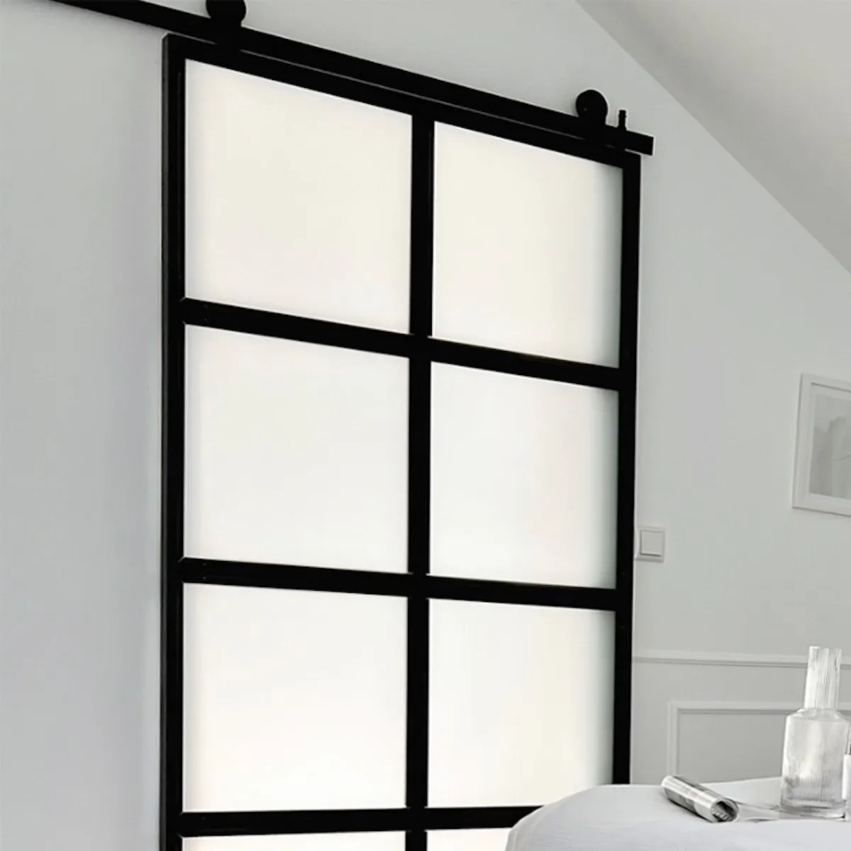 Loft sliding glass doors in an attic bedroom