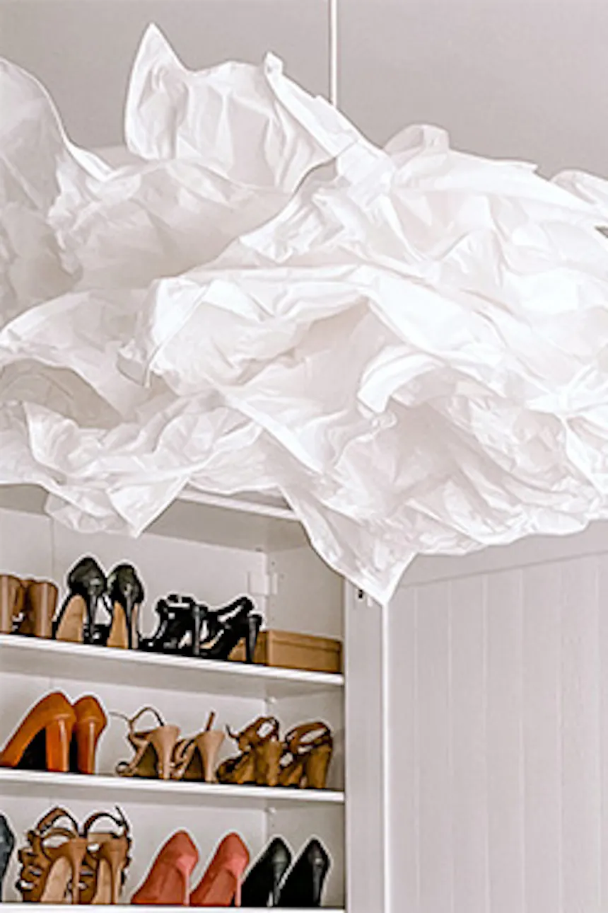 large white wardrobes, system of white wardrobes and shelves in the dressing room, white walk-in closet, pendant lamp paper lampshade, white pouf in the dressing room