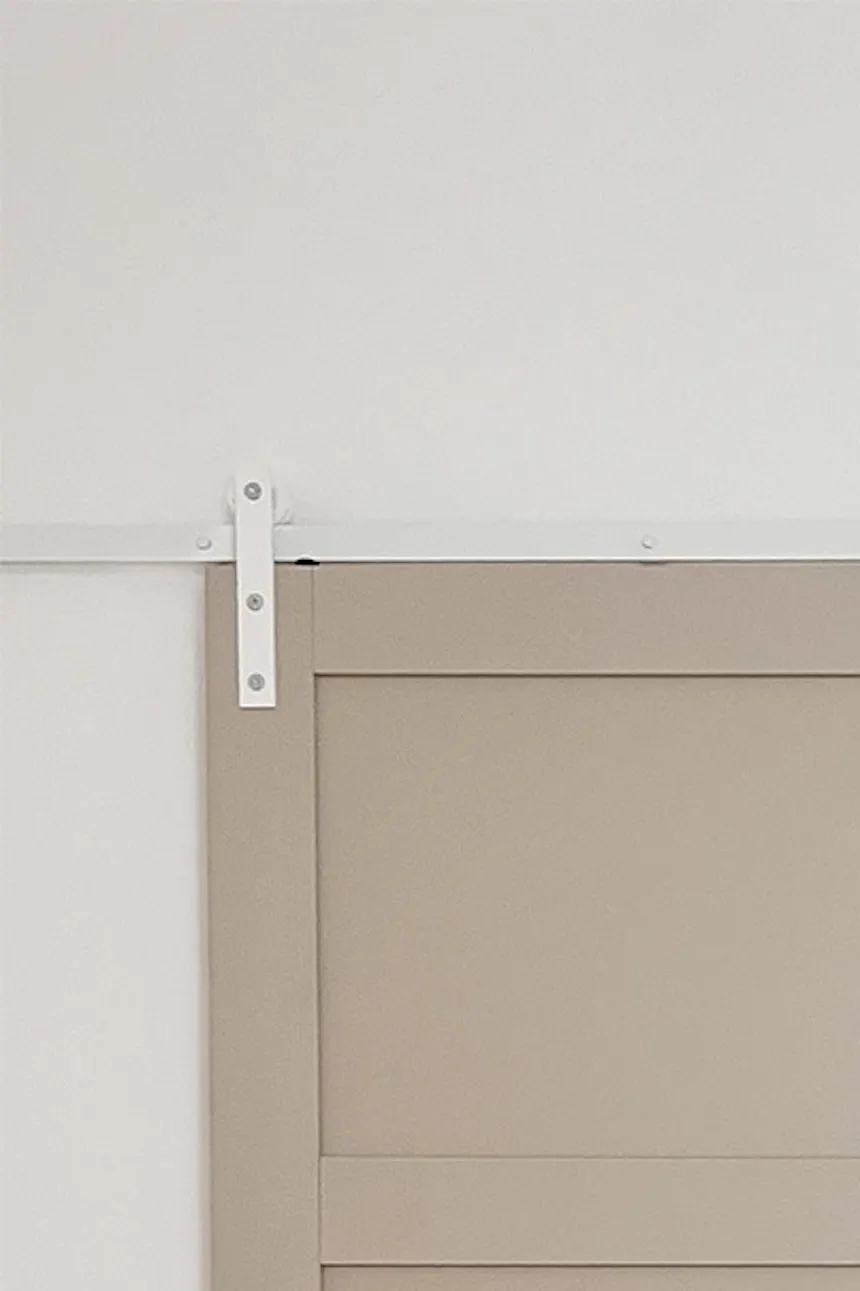Open pebble gray sliding door with white sliding system showing bathroom fragment