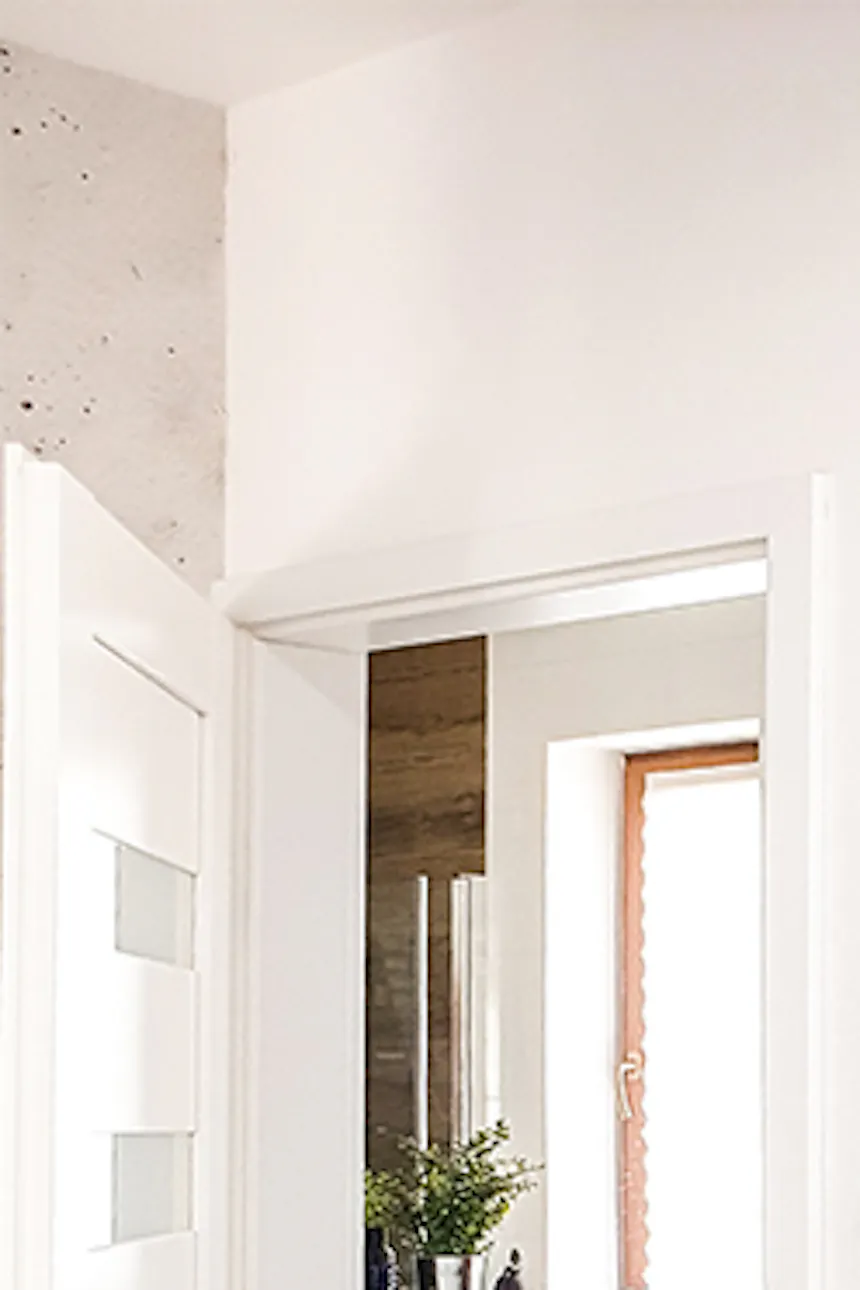 Anthracite sliding doors closing off entryway in modern home