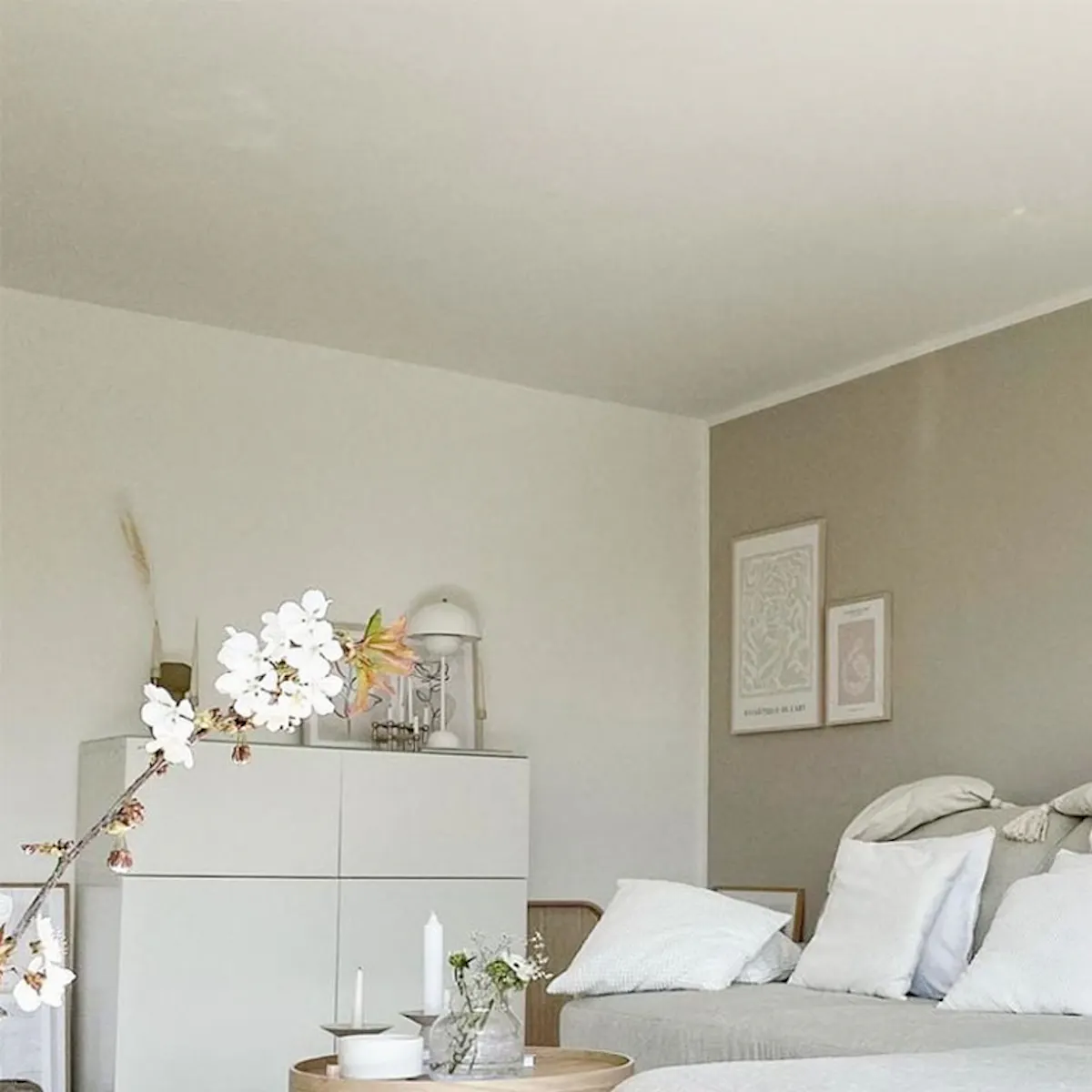 Large beige sofa with white pillows, Nordic style living room, white dresser, Scandinavian design