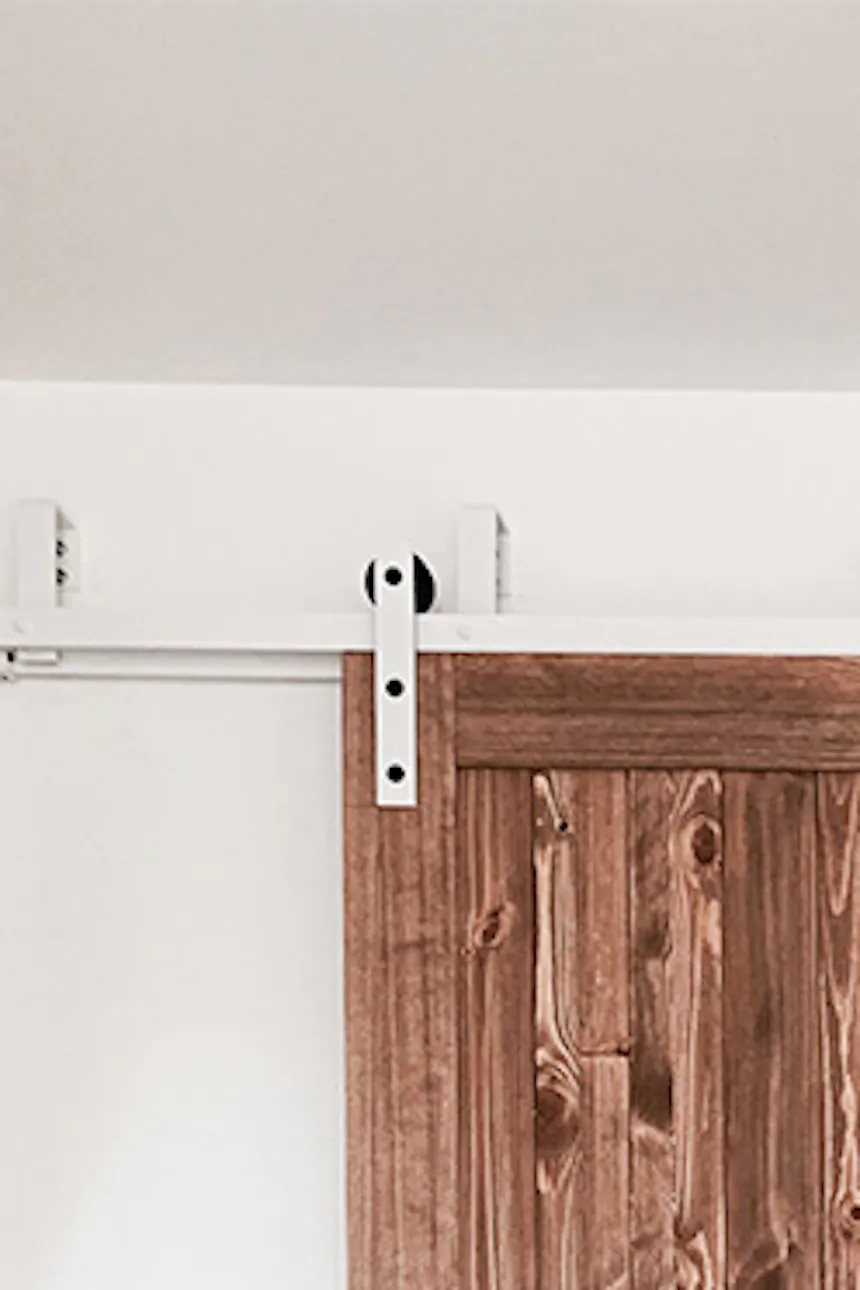 rustic bedroom, wooden sliding doors, bypass sliding doors, bypass wall bracket for sliding doors, rustic style interior, modern rustic style, barn sliding doors, white sliding system