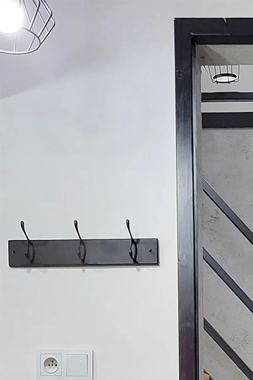 black door separating the bathroom from the hall