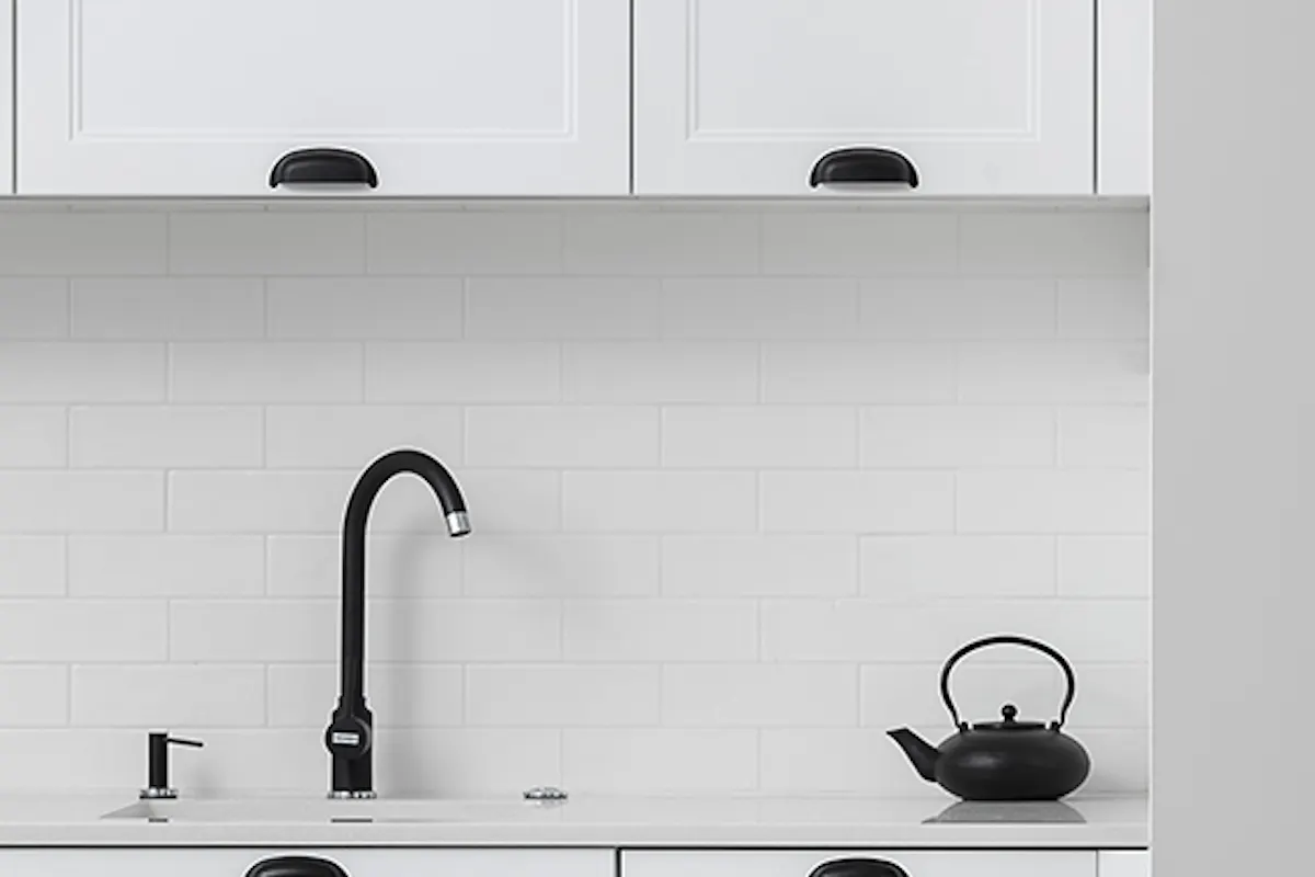 white kitchen with black accessories