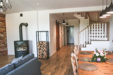 solid wood sliding door, Scandinavian interior, loft interior, kitchen door, barn door, brushed sliding door, kitchen sliding door, brick wall in living room, fireplace in living room, Scandinavian style in living room, open space, dining area in living room