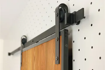 sliding door system, sliding door hanger, sliding door track, loft door, wooden door in a metal frame, wood and steel sliding door, pine door, dotted wallpaper