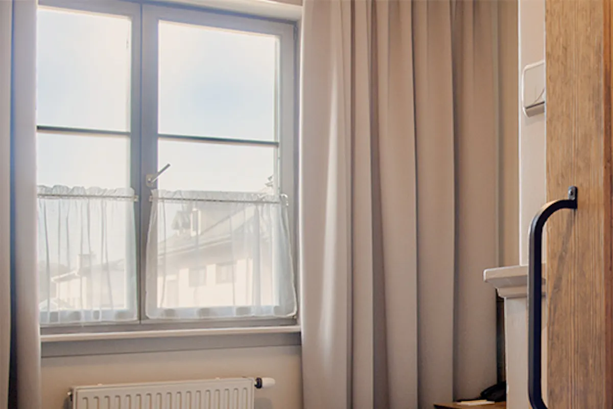 Sliding doors to bathroom with metal handle