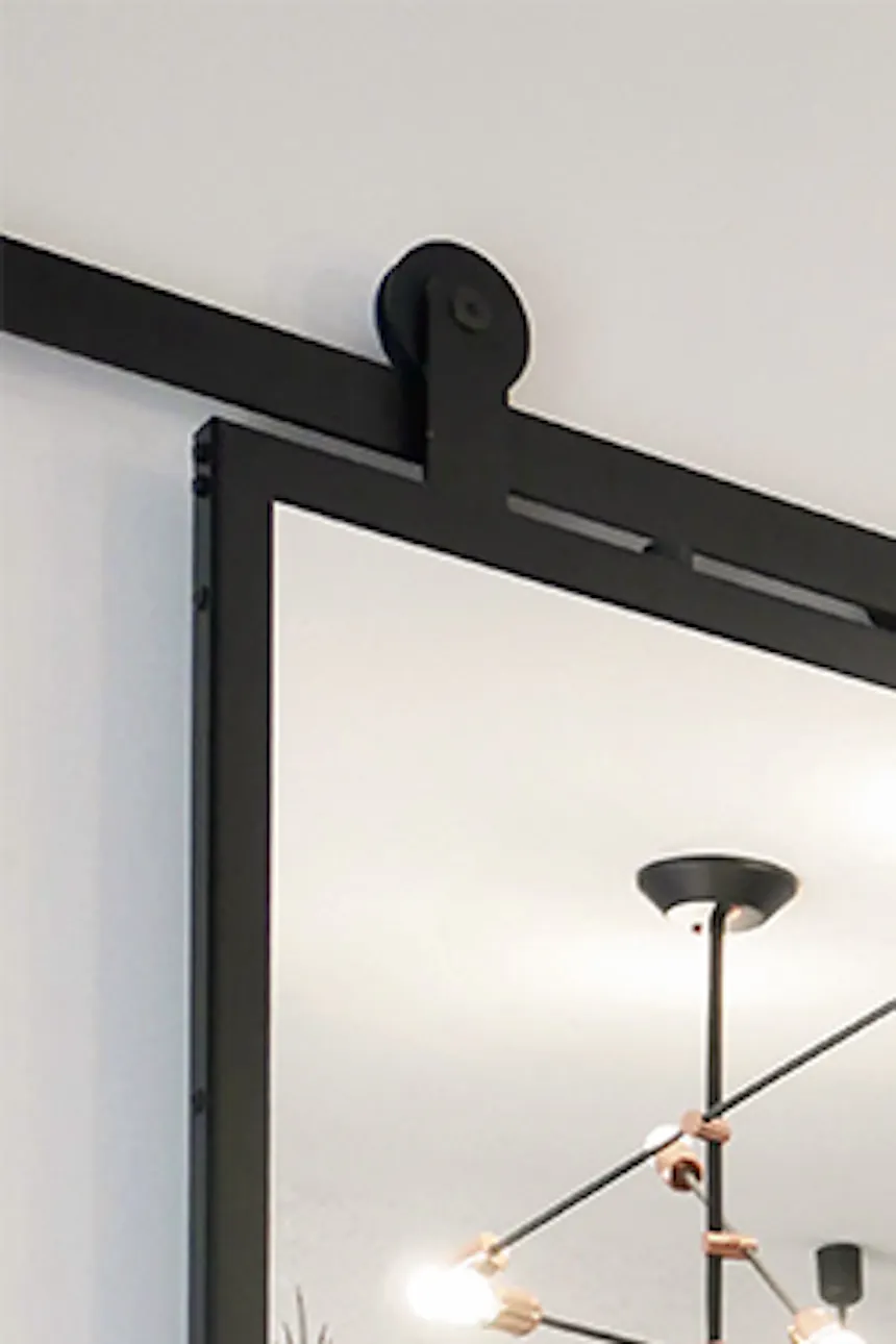 Double sliding door with mirror, black sliding system, sliding doors to the wardrobe, decorative wallpaper in the bedroom, industrial pendant lamps in the bedroom, large mirror in metal frame