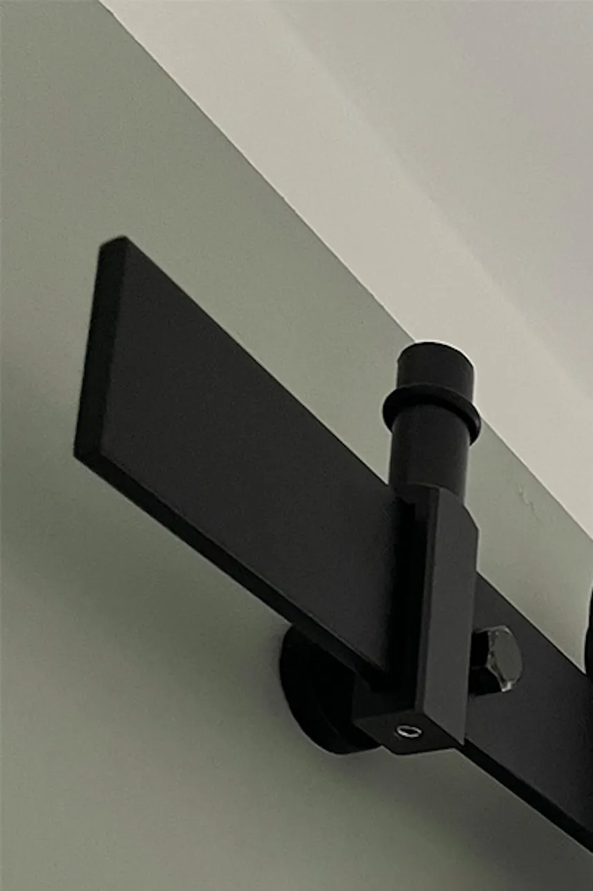 Black sliding system with white deeply brushed sliding door
