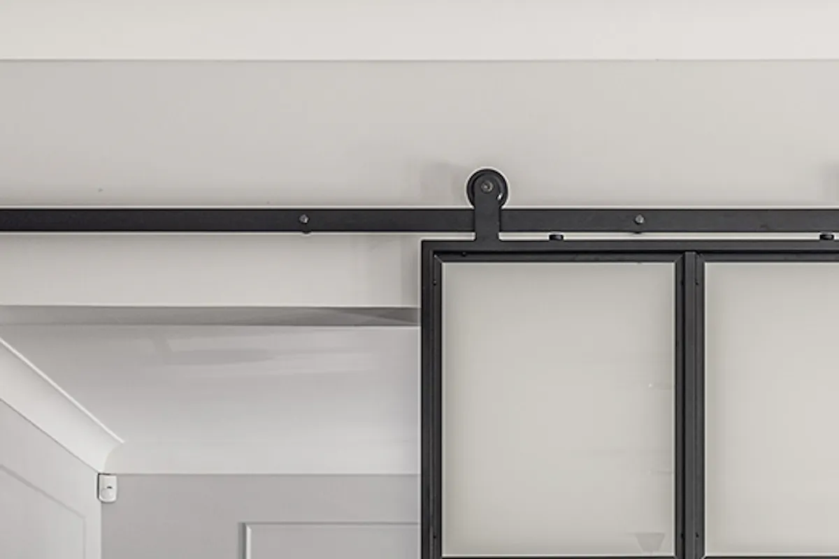 Metal and glass sliding doors with frosted glass in black metal frame, industrial sliding doors, metal wall planter