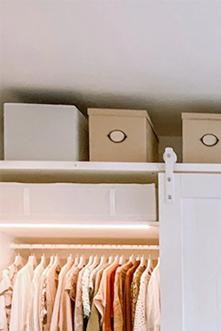 pendant lamp paper lampshade, white sliding doors for the wardrobe, barn door in the walk-in closet, a system of white wardrobes and shelves in the dressing room, large wardrobe in white, white doors on a white sliding system