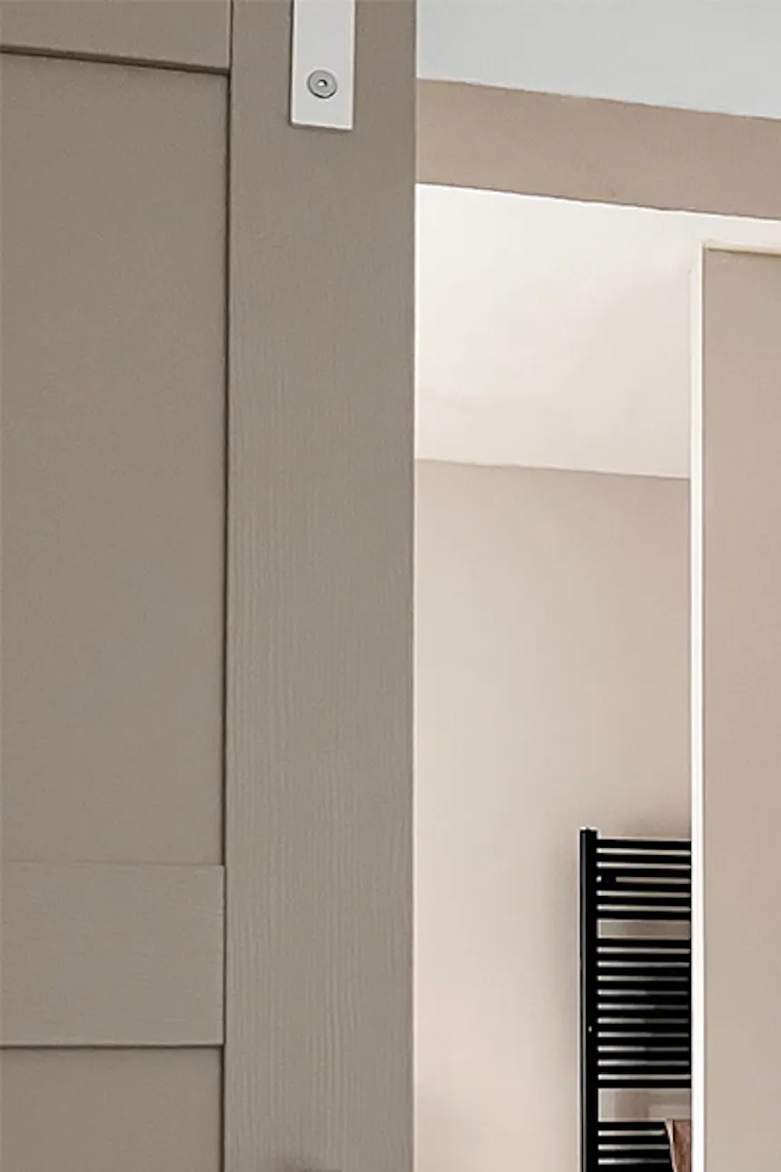 White vanity with two sinks in gray and beige bathroom