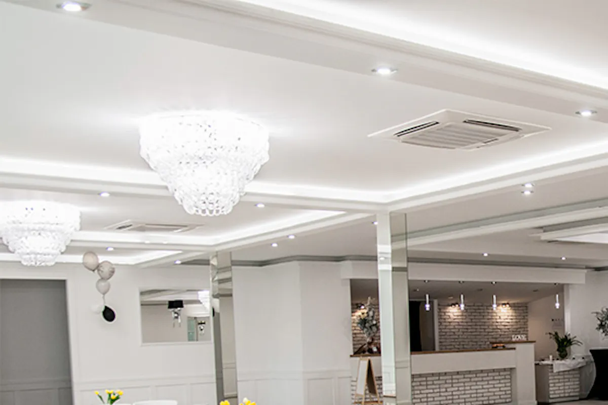 white sliding doors, a large crystal chandelier, large sliding doors, double sliding door, sliding doors with glass, white wooden doors with glass, indoor mirrors, ballroom