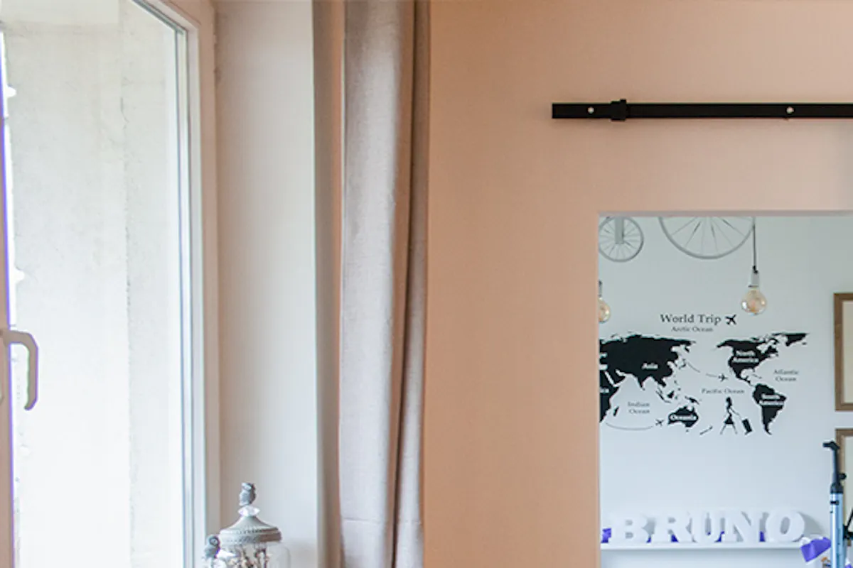 Mirror in metal frame in eclectic living room arrangement