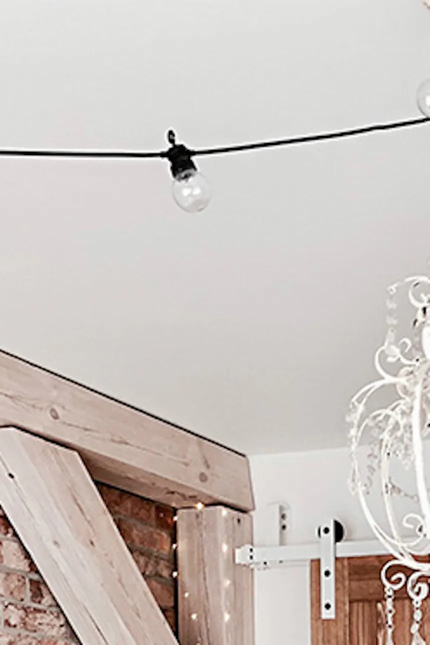 rustic bedroom, wooden sliding door, sliding door, rustic style interior, modern rustic style, barn sliding doors, white sliding system, bypass sliding doors, bypass wall bracket for sliding doors, white rustic chandeliers, brick bedroom wall