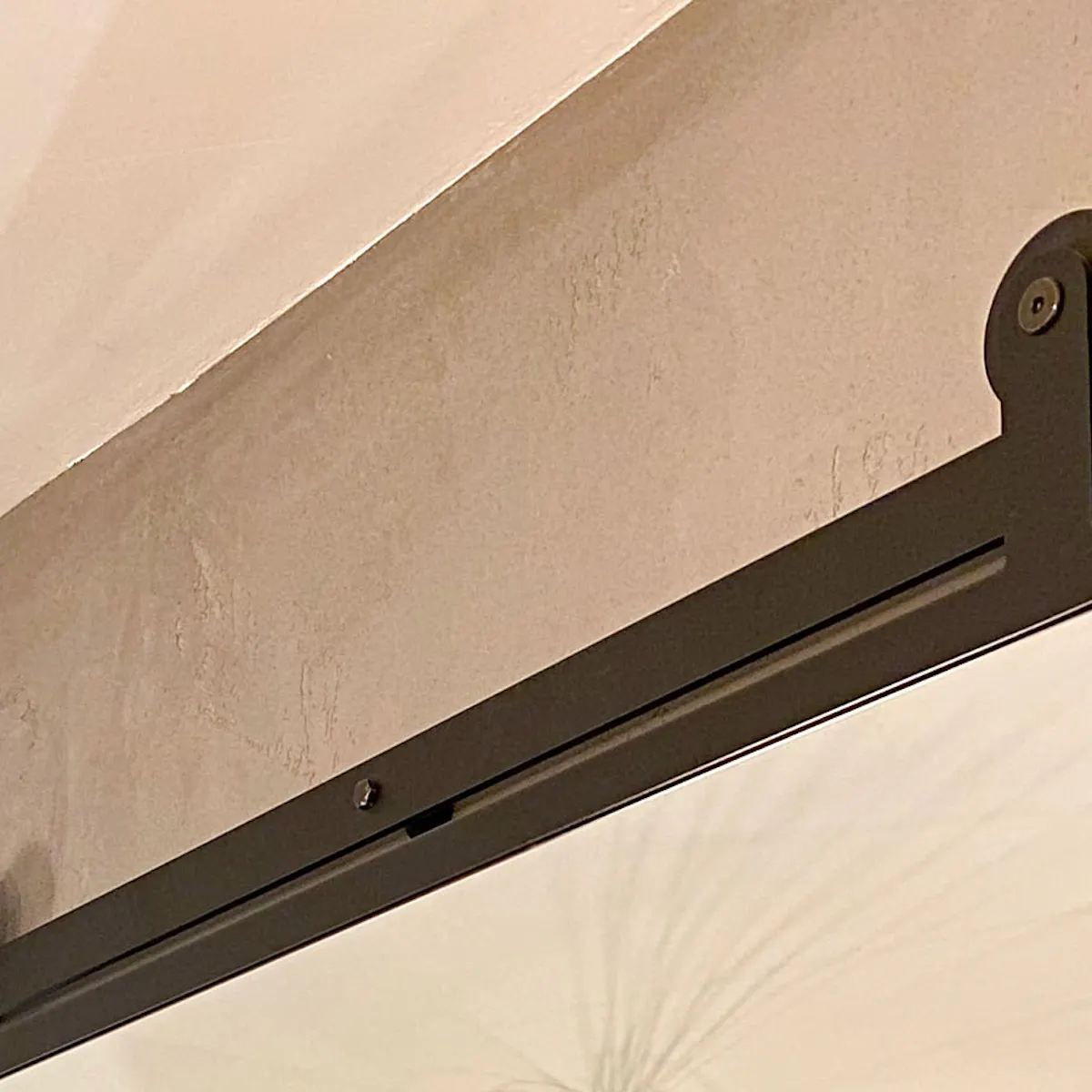 Sliding mirror in a black metal frame