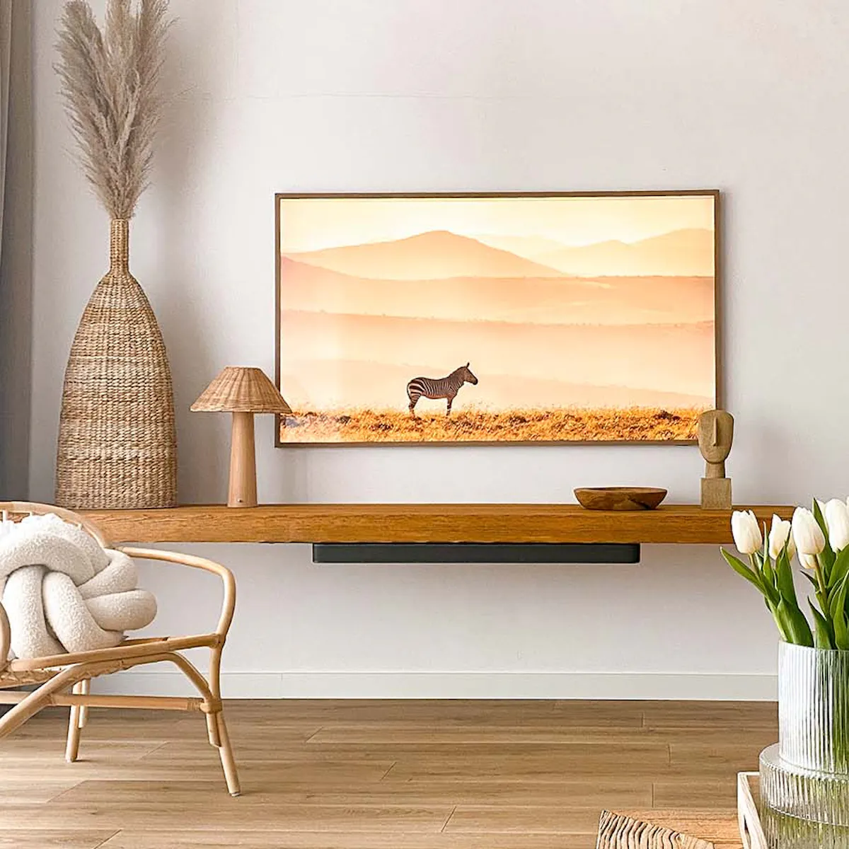 White walls, wood paneling, wooden coffee table, and woven seagrass accents in the living room