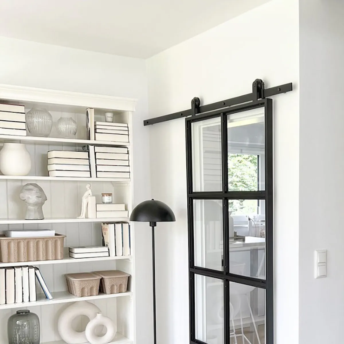 Industrial glass sliding doors closing kitchen entrance