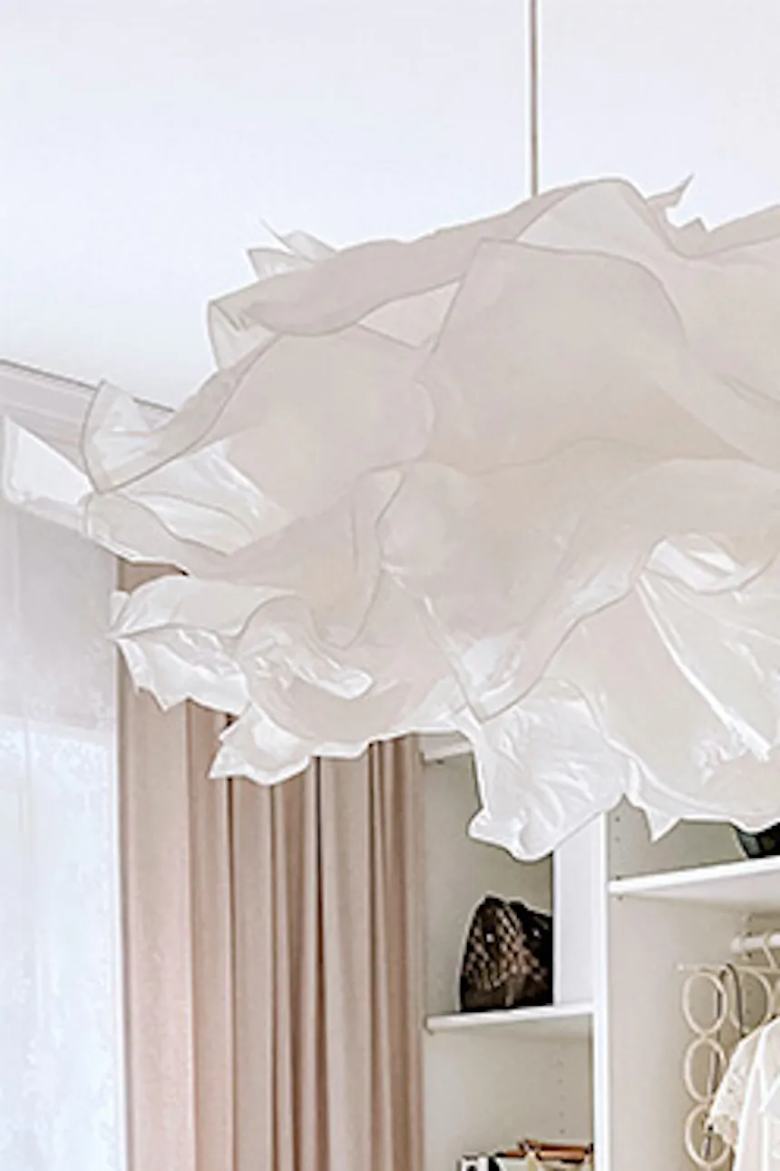 system of white shelves in the dressing room, large bright dressing room, white shelves, white pouf in the walk-in closet, pendant lamp paper lampshade