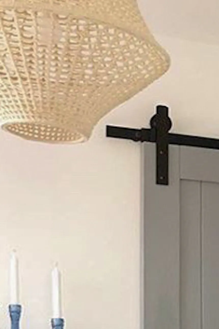 bedroom sliding door, grey wooden sliding door, wooden door, grey door, atmospheric bedroom, mint and grey interior, bedroom arrangement, white dresser in the living room, light interior, pastel colours