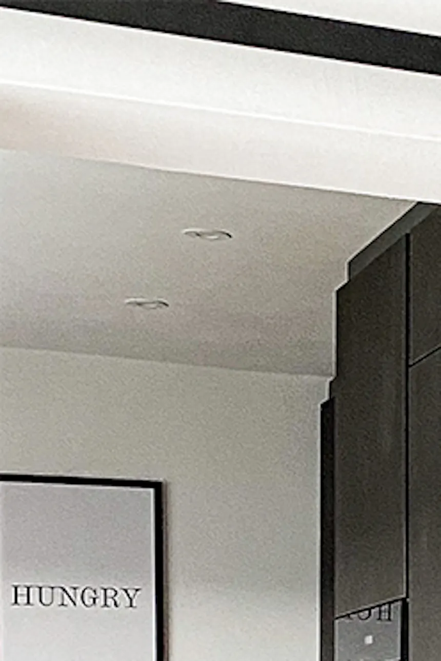 wood and metal in the dining room, dark brown fitted kitchen, dark furniture in the kitchen, wooden sliding door, sliding system, wooden door to the kitchen
