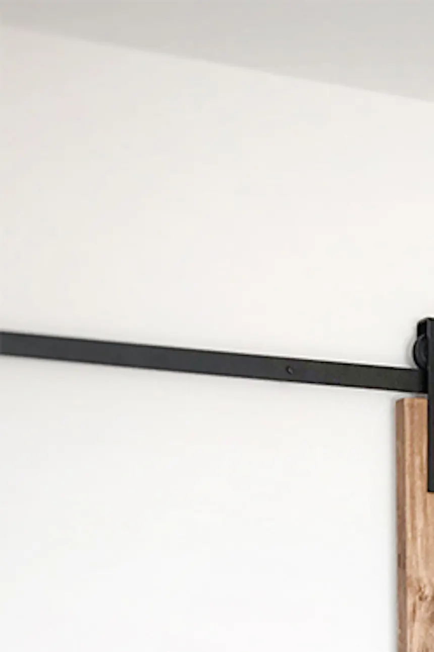 Wooden sliding door, closet door, bedroom dressing room, sliding door, wooden door, brick in bedroom, hanging bedside lamp, vintage style, vintage bedroom