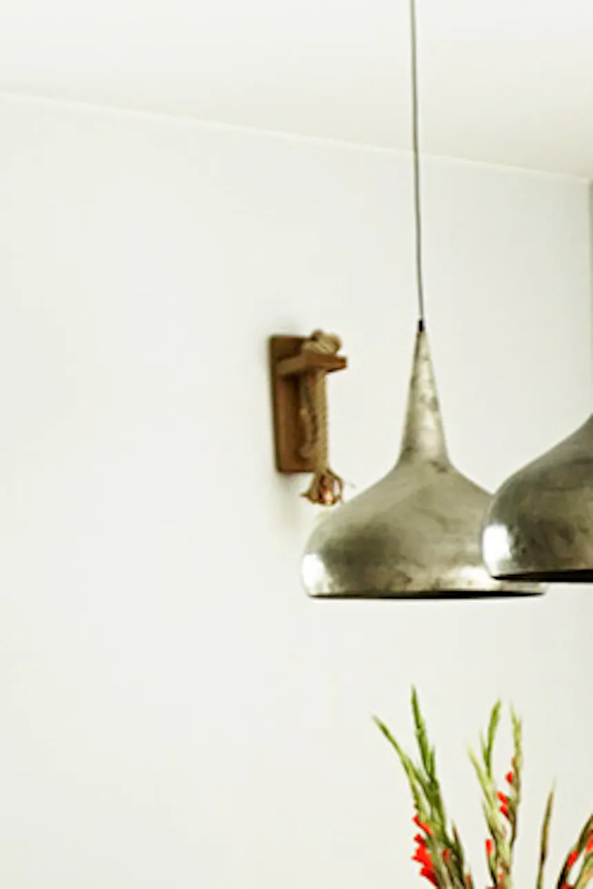 Dining nook, pendant lights, colorful dining chairs, wooden dining table