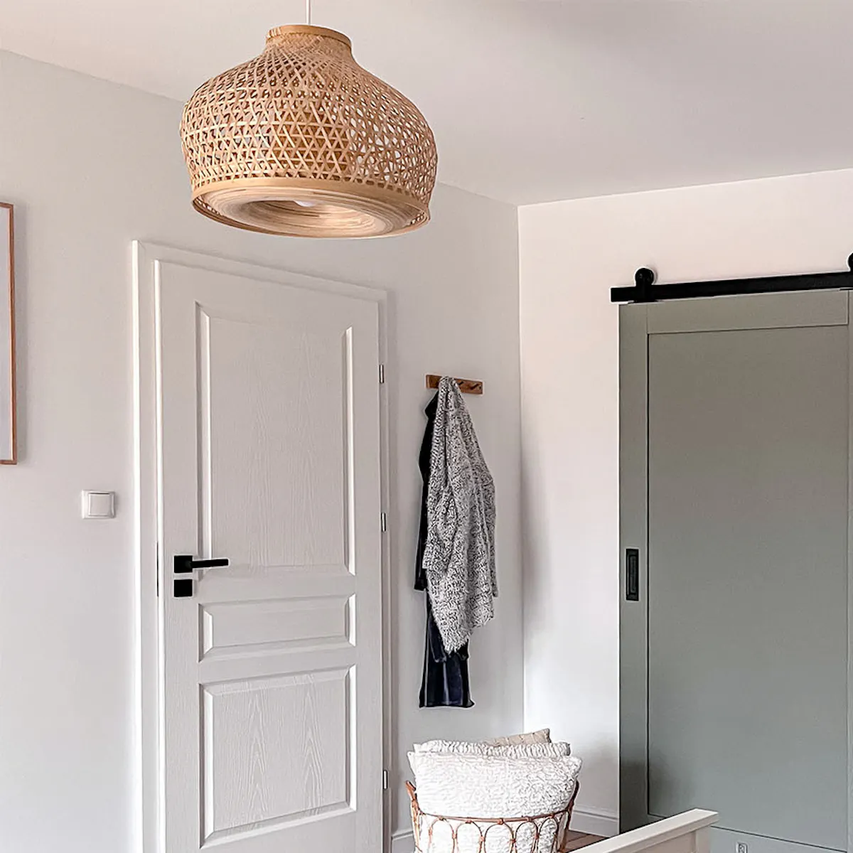 Gray sliding doors to walk-in closet in bedroom