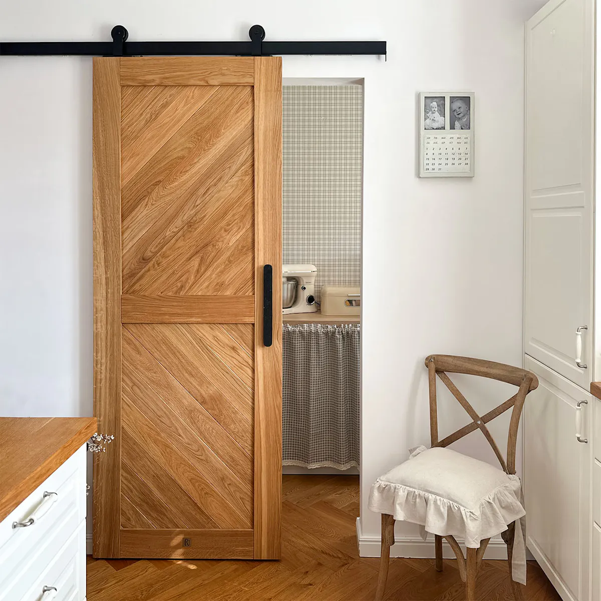 CARO oak sliding doors in the passageway to the home pantry.