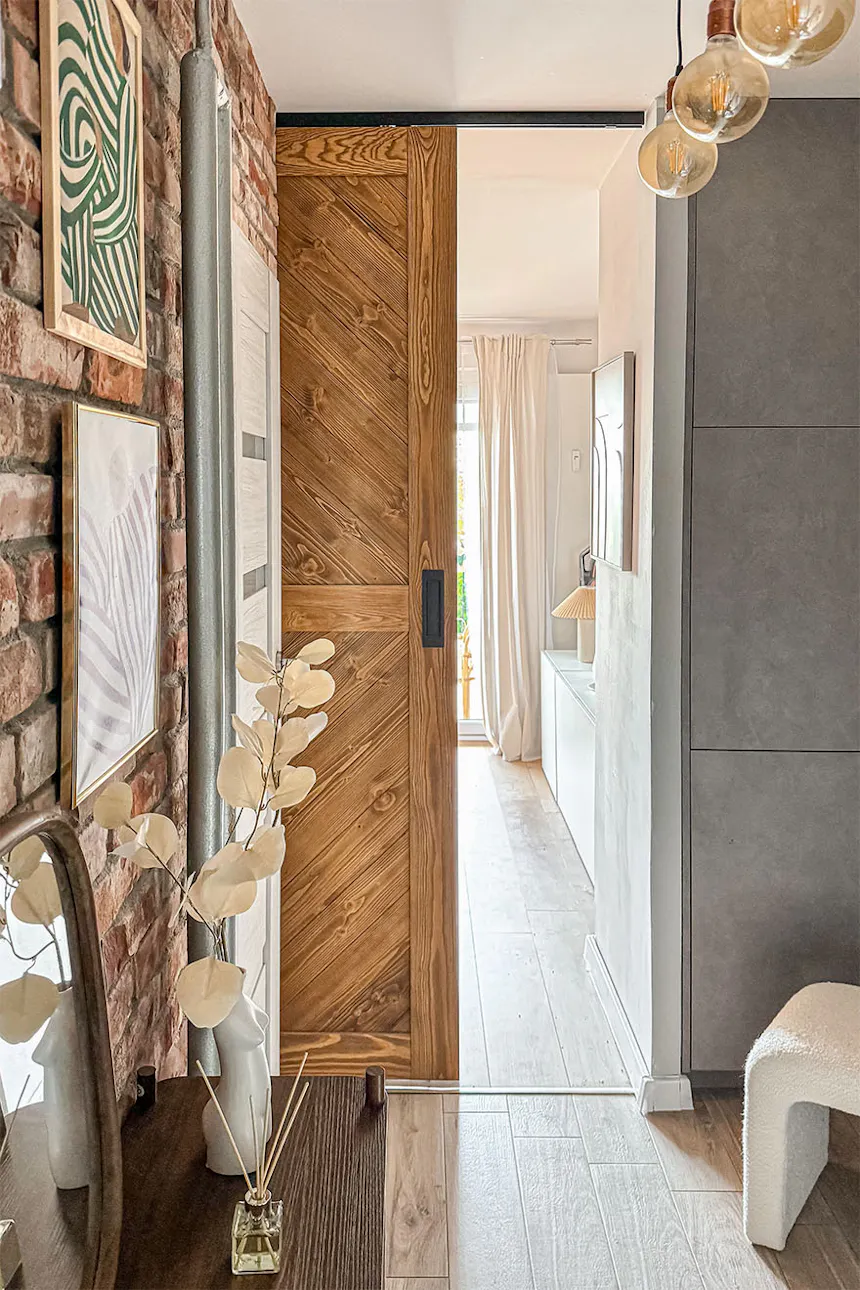 Hallway with sliding doors in apartment building.