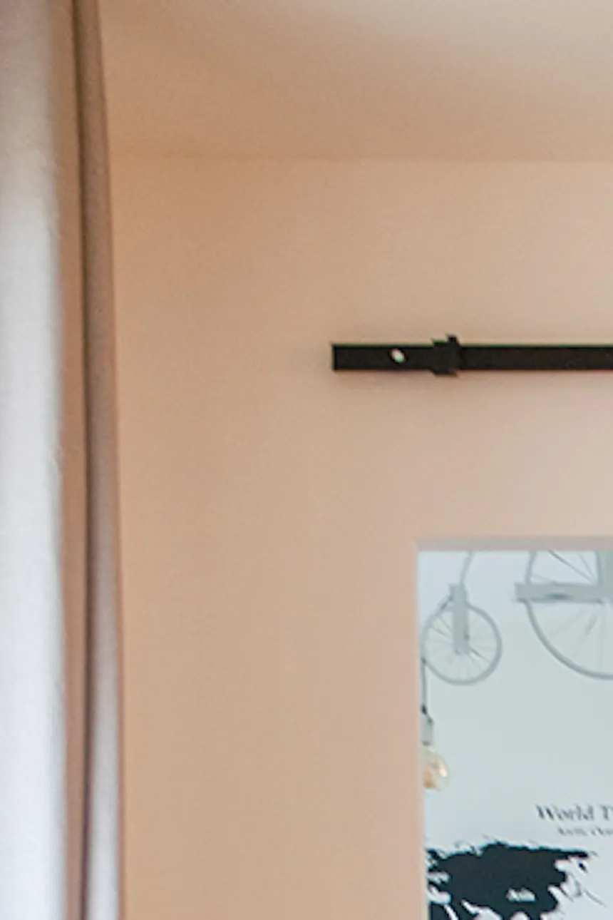 Sliding door with mirror, door with mirror in metal frame, sliding door in modern interior, green sofa, modern-style dresser, Scandinavian-style table