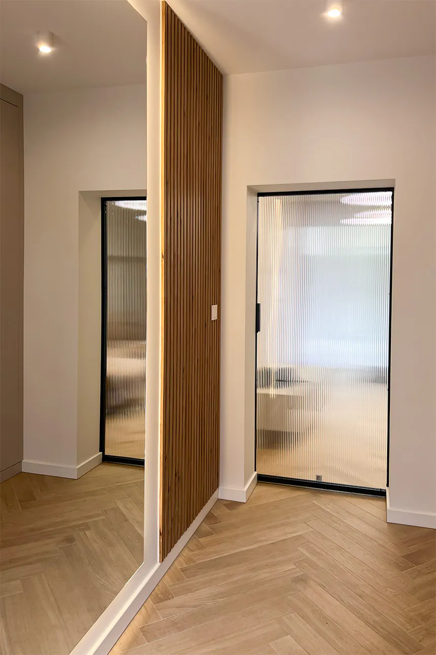Steel doors with glass. Fluted glass design. Striking linear light reflections inside.