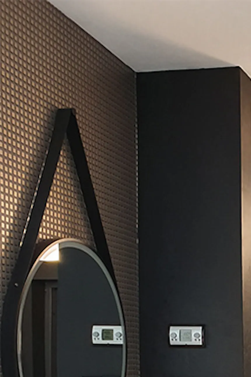 Black and white foyer, loft table in foyer, wood and metal, black walls
