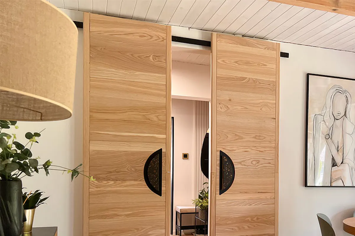 designer sliding doors in the arrangement of a guest room in natural colours