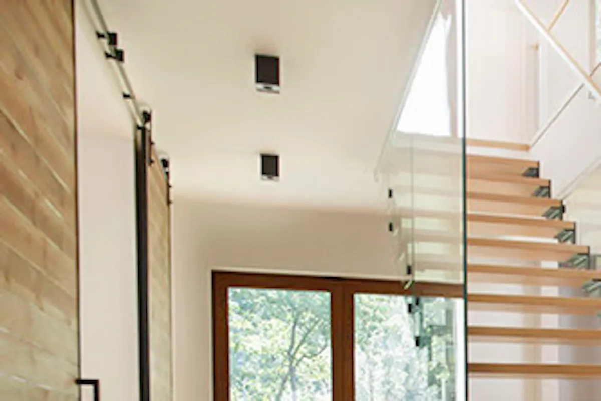 Open wood staircase in spacious living room