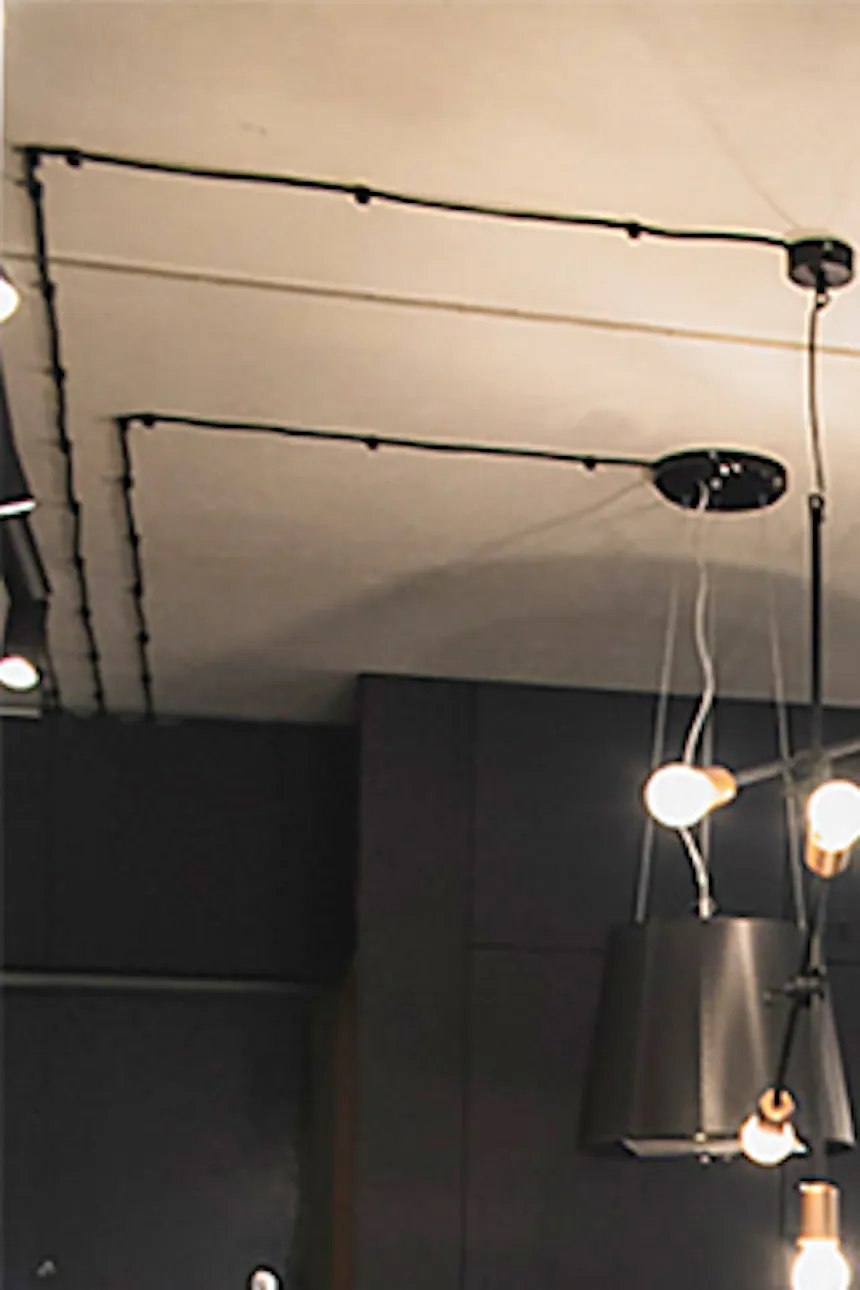 White and black colors in kitchen, black pendant lamp over island, open kitchen with island, industrial-style lamps
