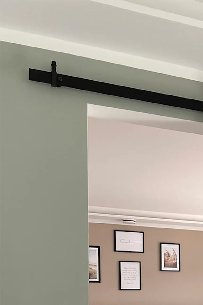 White sliding door to bedroom on black sliding system, entrance to modern bedroom