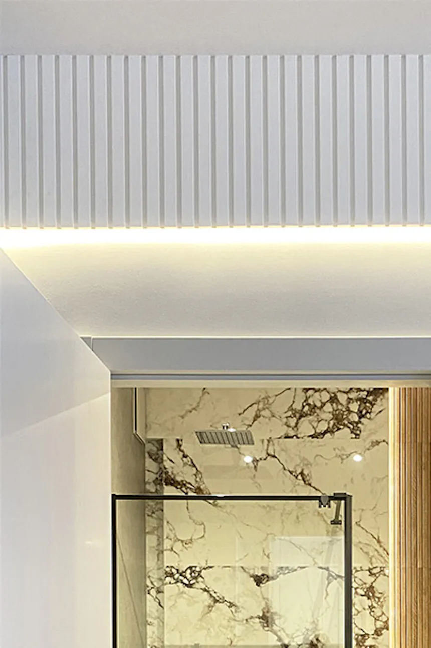 Glass sliding doors beside modern bathroom entrance, minimalist bathroom, light walls and linear stucco in modern apartment