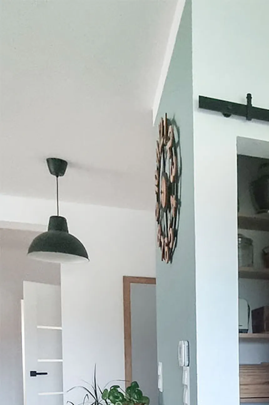 open wooden sliding doors for a small pantry in a bright kitchen