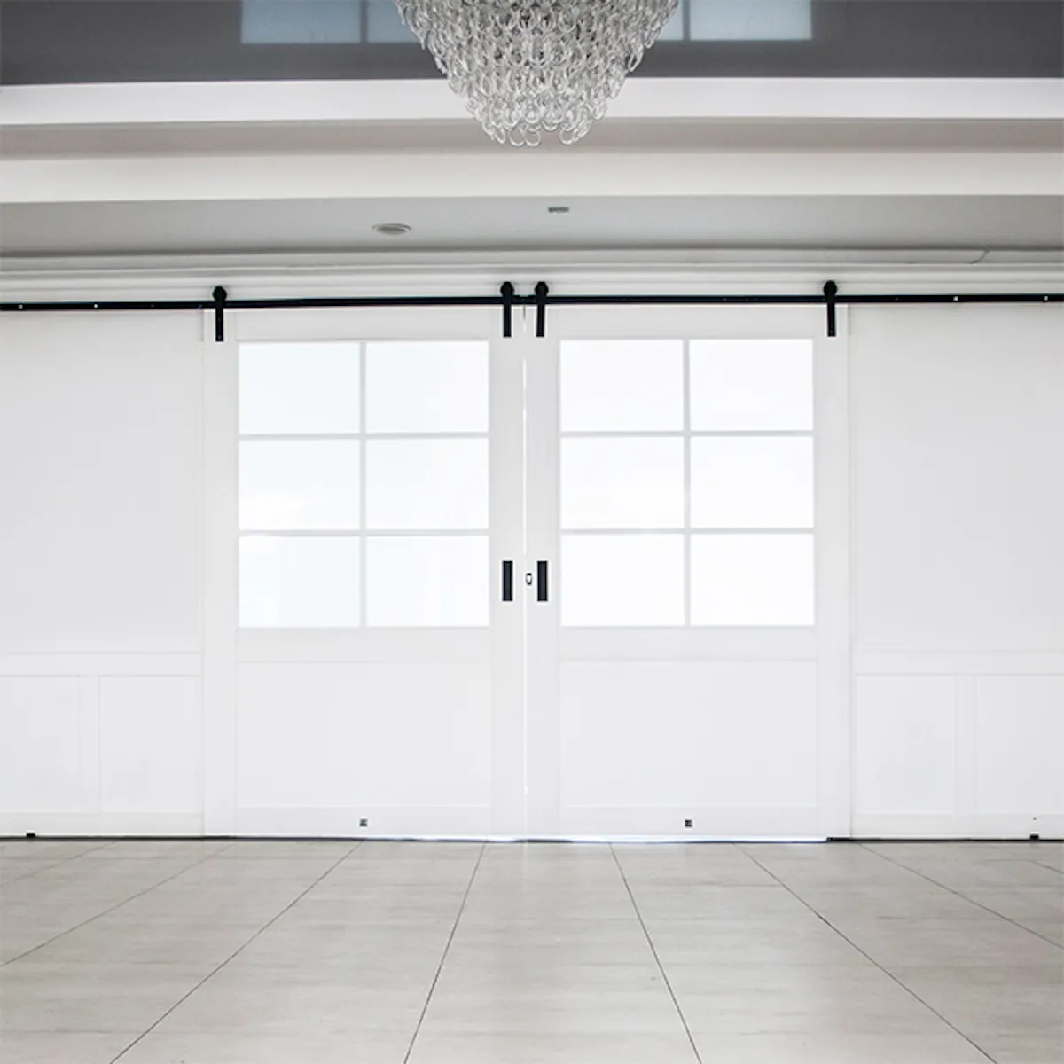white sliding doors, large sliding doors, double sliding door, sliding doors with glass, white wooden doors with glass, ballroom entrance