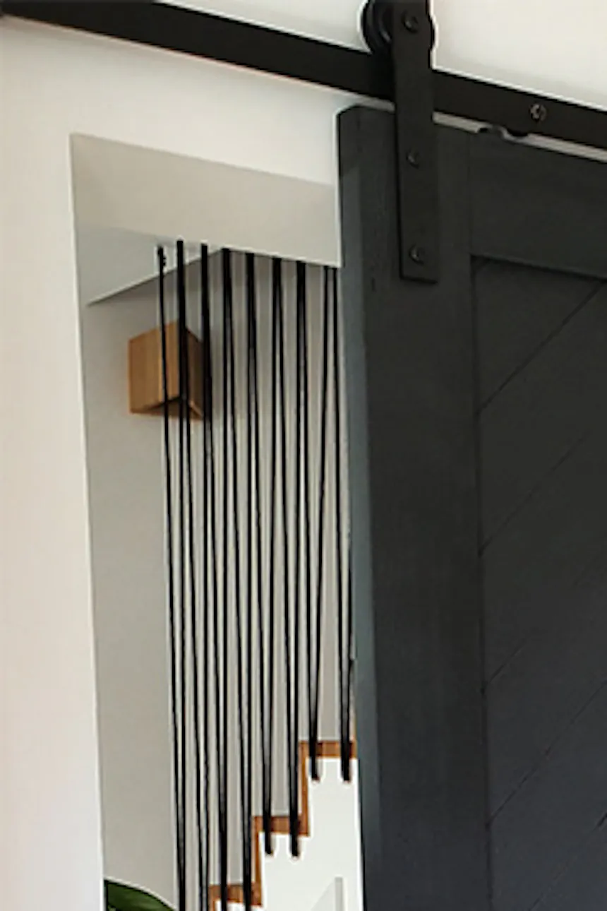 Elegant black sliding doors, entrance to living room with sliding doors