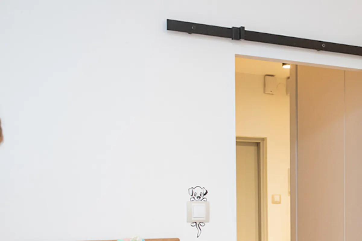 Sliding door in apartment, wooden sliding door, white sliding door, elegant sliding door, sliding door in kids' room, space-saving sliding door, girls' room décor, white desk for girls