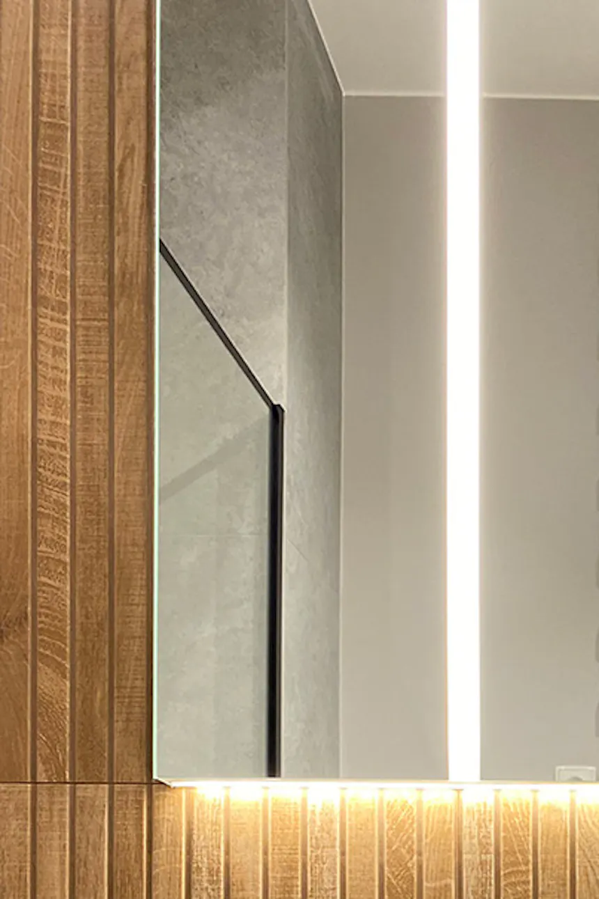 Modern bathroom with white fixtures and wood-tone tiles