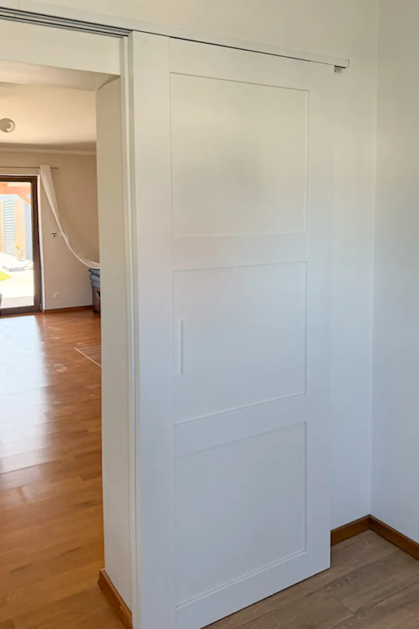 White bypass sliding doors with two panels on parallel wall tracks