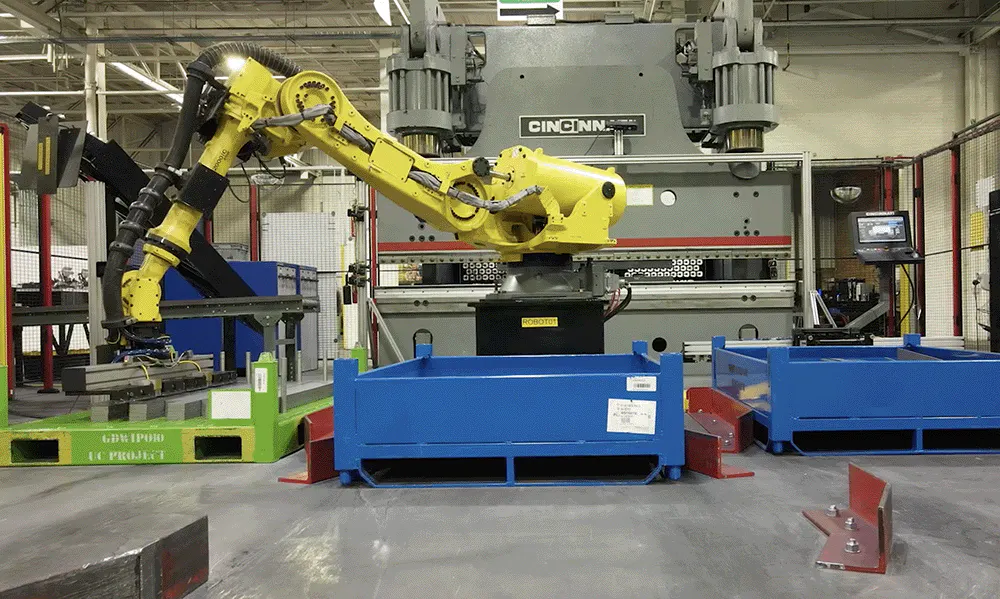 A yellow robot in an automated press brake
