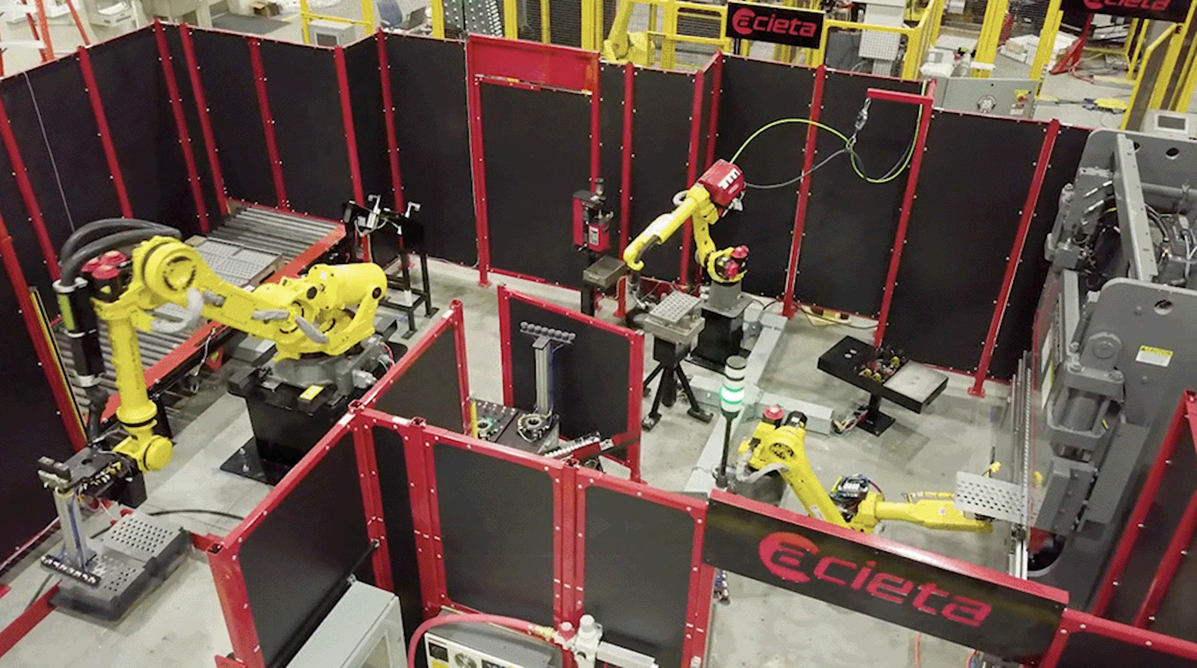 A robotic automation cell with three robots