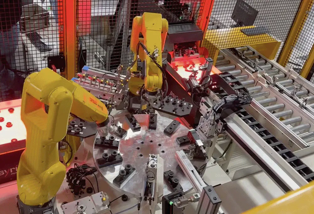 yellow robots in an automated assembly cell